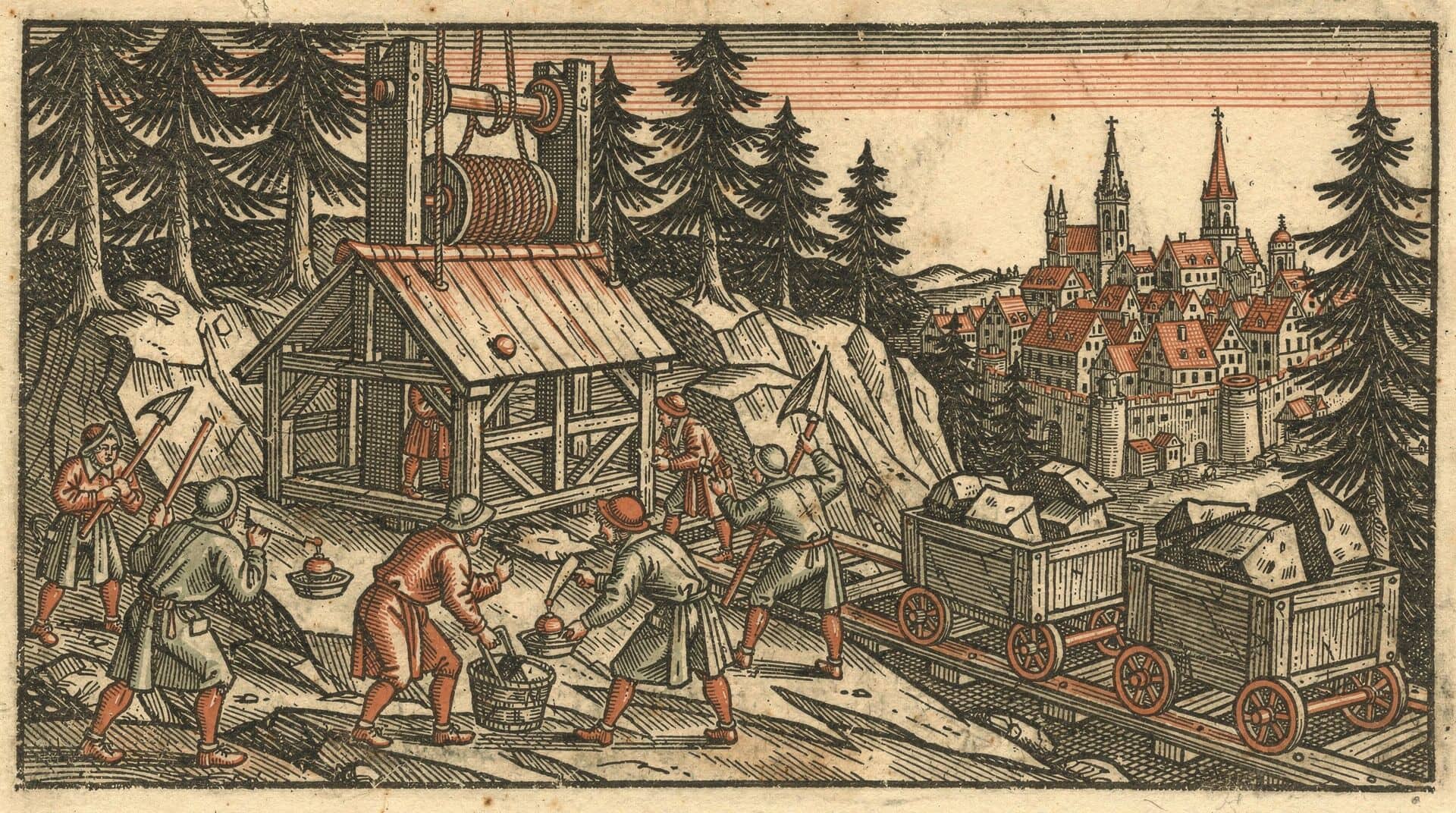 Hand-colored woodcut of miners at work outside a timber shaft house with a rope winch, ore carts on wooden rails, and a walled town with church spires beyond the spruce forest.